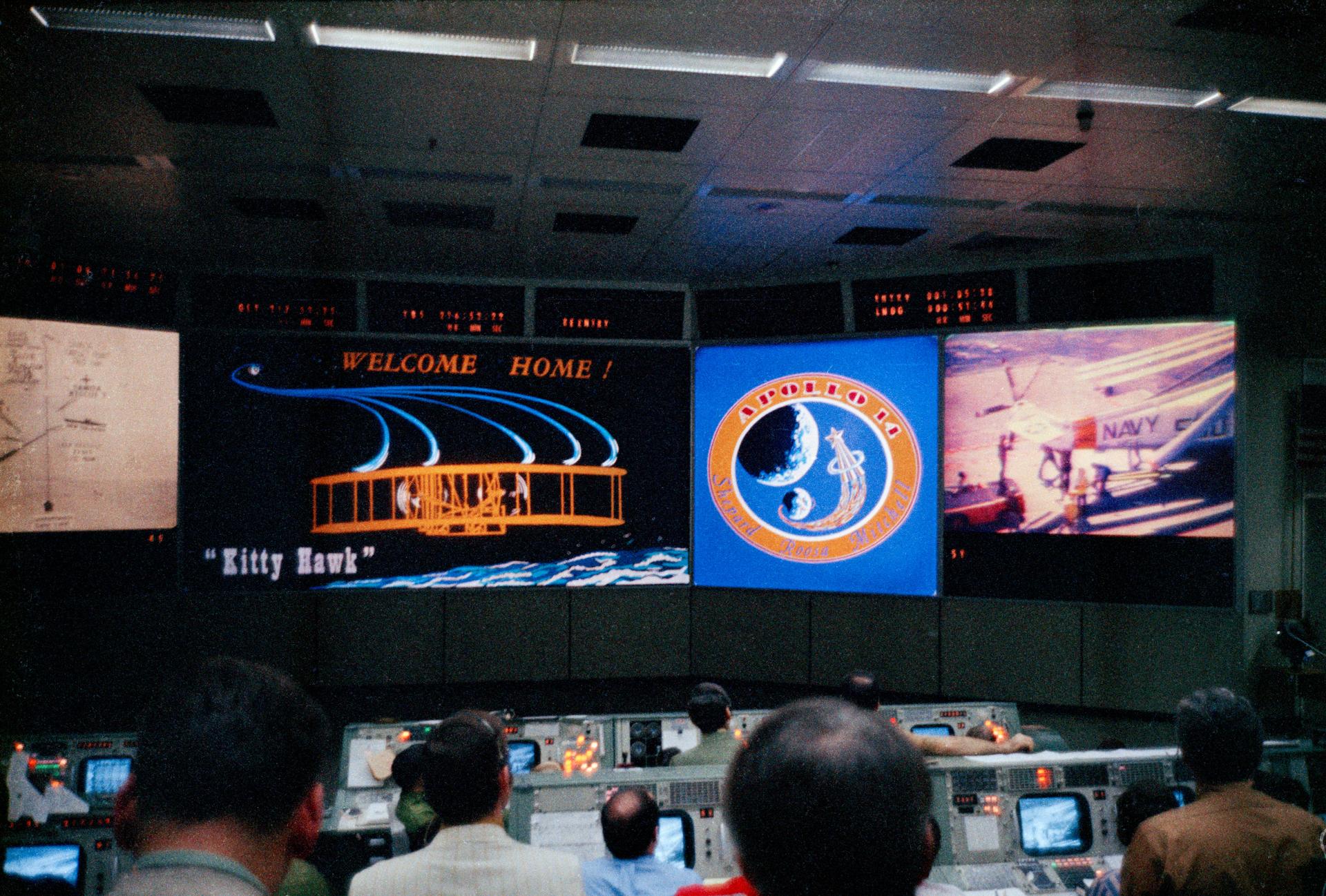 Public domain NASA photograph of Apollo flight controllers watching mission data in mission control.